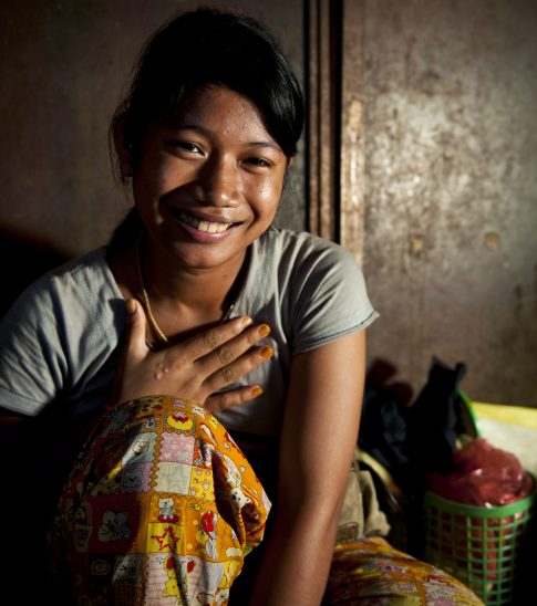 Teenaged girl smiling at the camera.